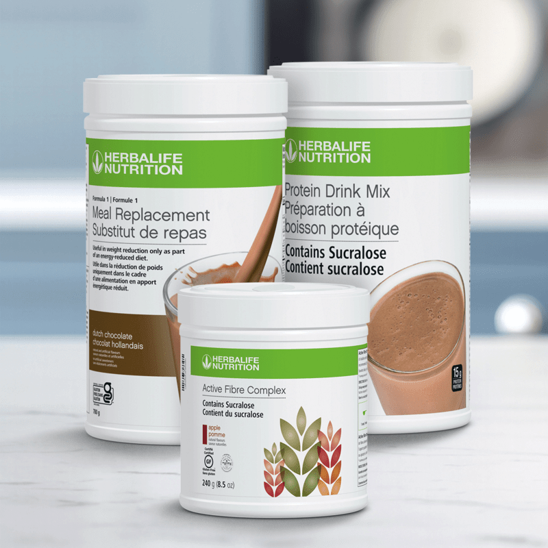 Nutrition Companion Classic Herbalife products including chocolate protein shake and active fibre complex on a table.